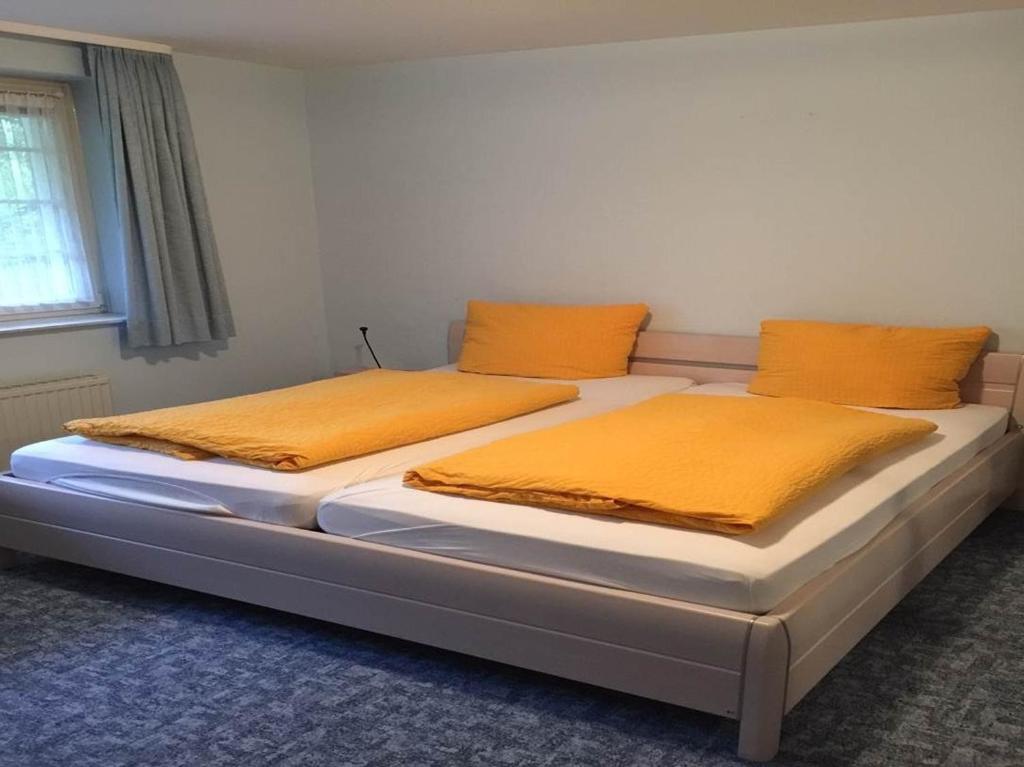 Postel nebo postele na pokoji v ubytování Hotel Carlsruh
