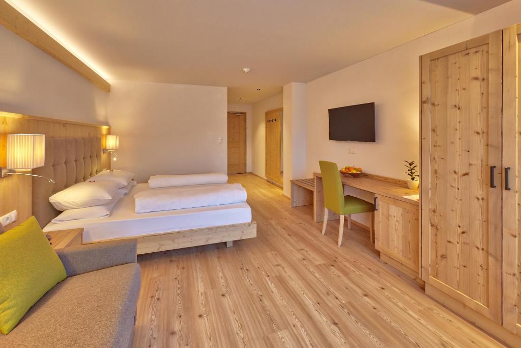 Postel nebo postele na pokoji v ubytování Hotel Rose