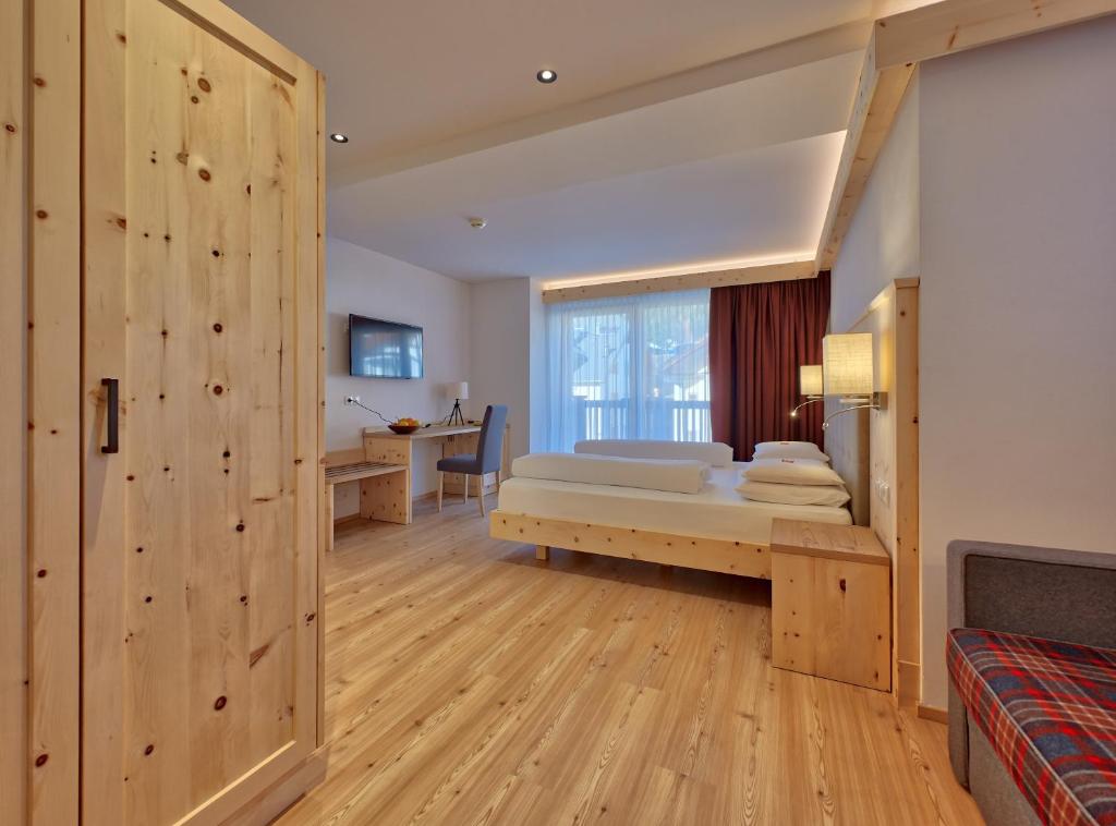 Postel nebo postele na pokoji v ubytování Hotel Rose