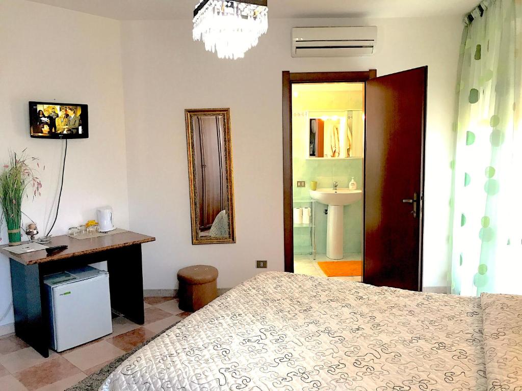 Postel nebo postele na pokoji v ubytování Magralù 2 B&B