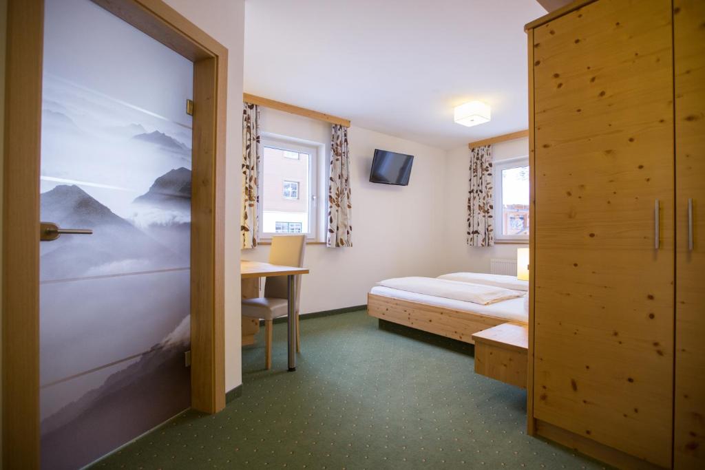 Postel nebo postele na pokoji v ubytování Hotel Ennskraxblick