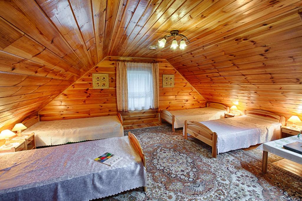Postel nebo postele na pokoji v ubytování Aleksandrówka - Domek Aleksander