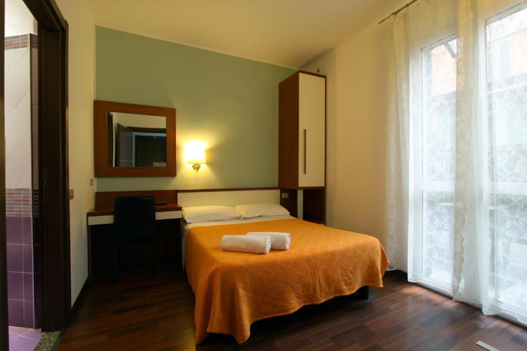 Voodi või voodid majutusasutuse Lux Hotel Durante toas