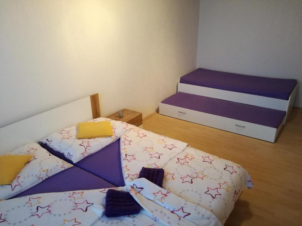 Postel nebo postele na pokoji v ubytování apartmány 2+1 u Klínovce