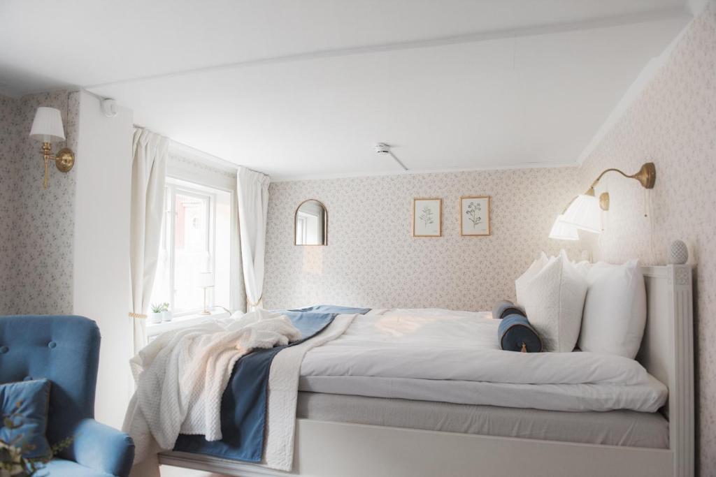 Postel nebo postele na pokoji v ubytování Hilma Winblads Bed & Breakfast
