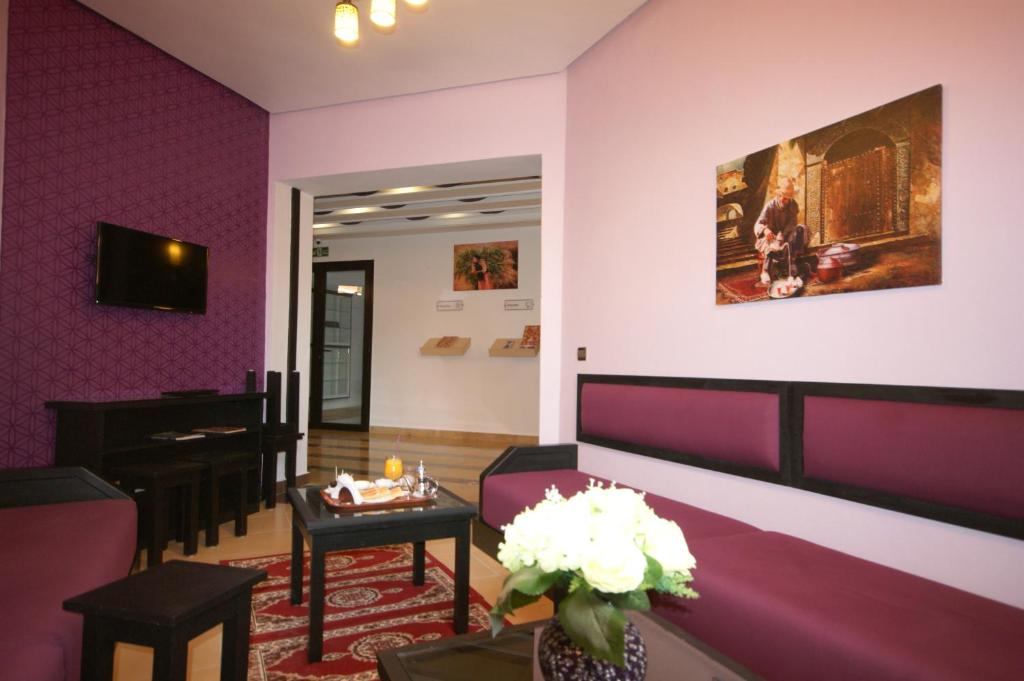 TV a/nebo společenská místnost v ubytování INOU Hotel