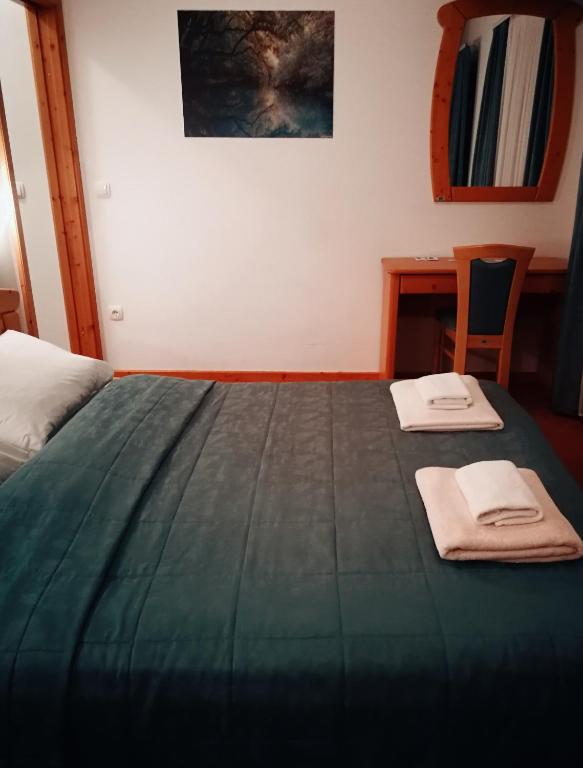 Postel nebo postele na pokoji v ubytování Hotel Rakov Skocjan