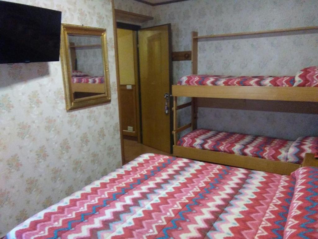 Postel nebo postele na pokoji v ubytování Hotel Sporting