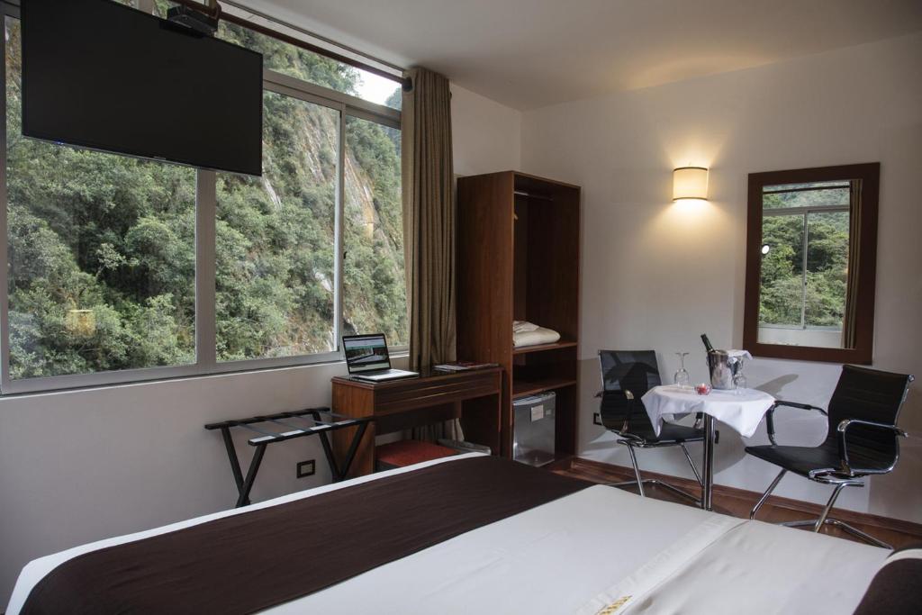 Hotel Ferre Machu Picchu tesisinde bir televizyon ve/veya eğlence merkezi