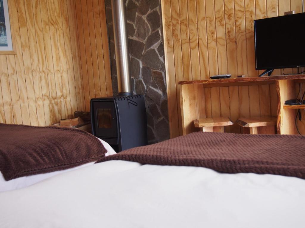 Ein Bett oder Betten in einem Zimmer der Unterkunft Hotel Último Paraíso