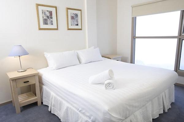 Кровать или кровати в номере White Crystal Apartments