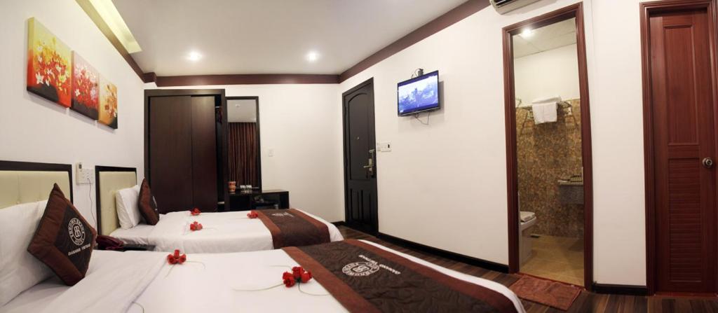 Postel nebo postele na pokoji v ubytování Brown Bean 2 Hotel
