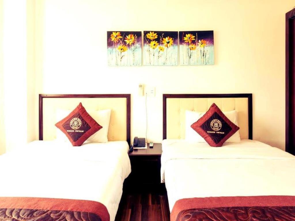 Postel nebo postele na pokoji v ubytování Brown Bean 2 Hotel