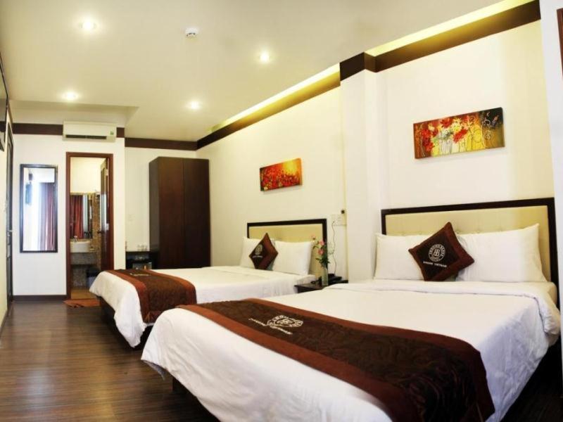 Postel nebo postele na pokoji v ubytování Brown Bean 2 Hotel