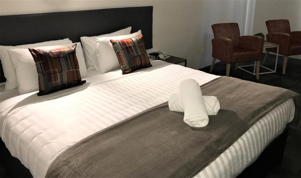 Postel nebo postele na pokoji v ubytování Hotel Clipper