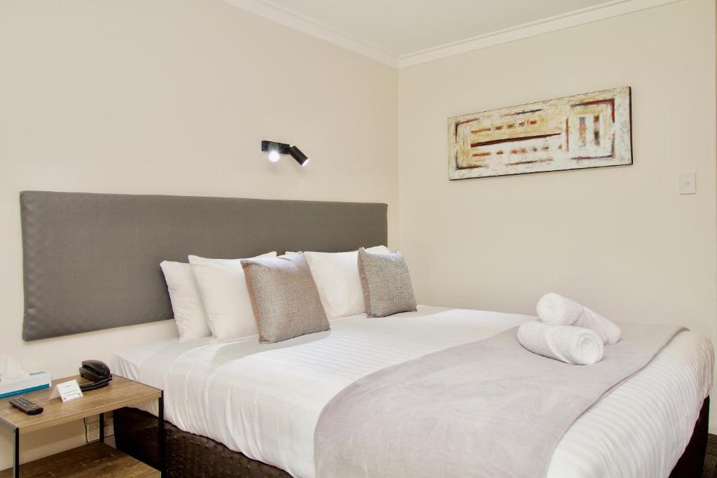 Postel nebo postele na pokoji v ubytování Hotel Clipper