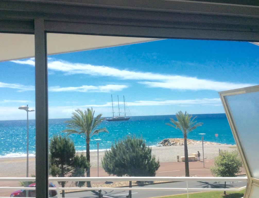 a view of the ocean from a hotel window at Appartement Dolce Vita in Cagnes-sur-Mer