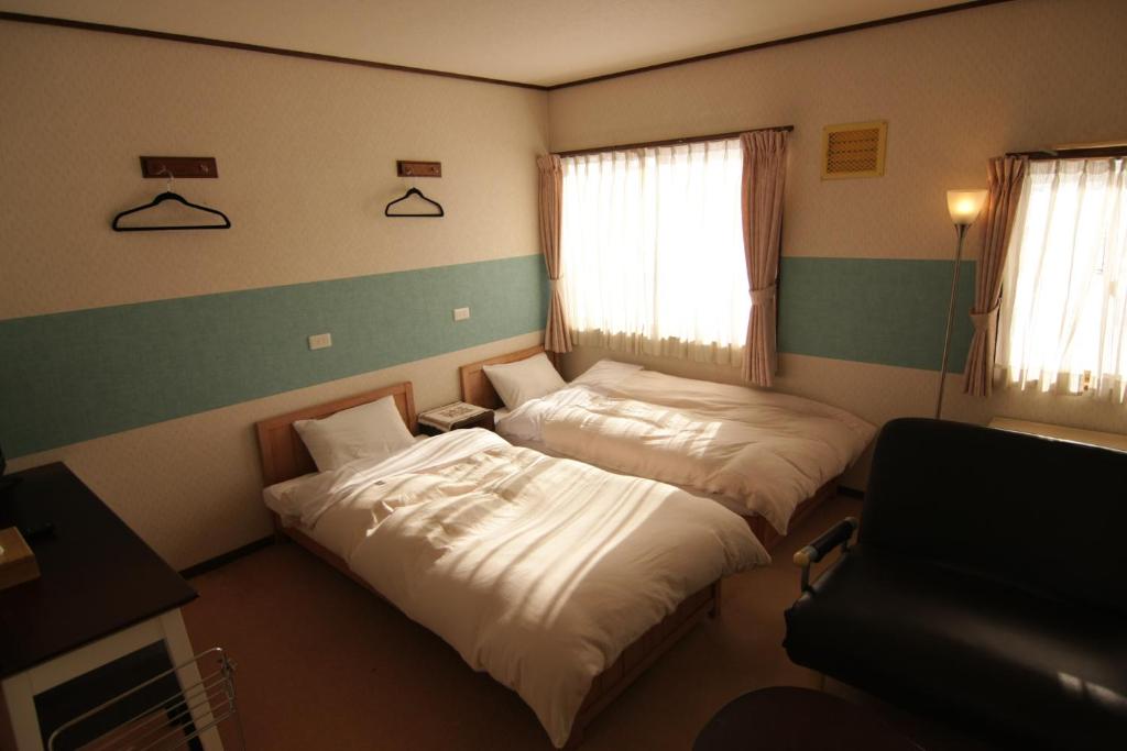Postel nebo postele na pokoji v ubytování Lodge Hahnenkamm
