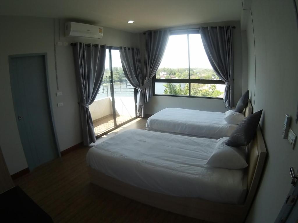 Postel nebo postele na pokoji v ubytování Na Siri Lake View
