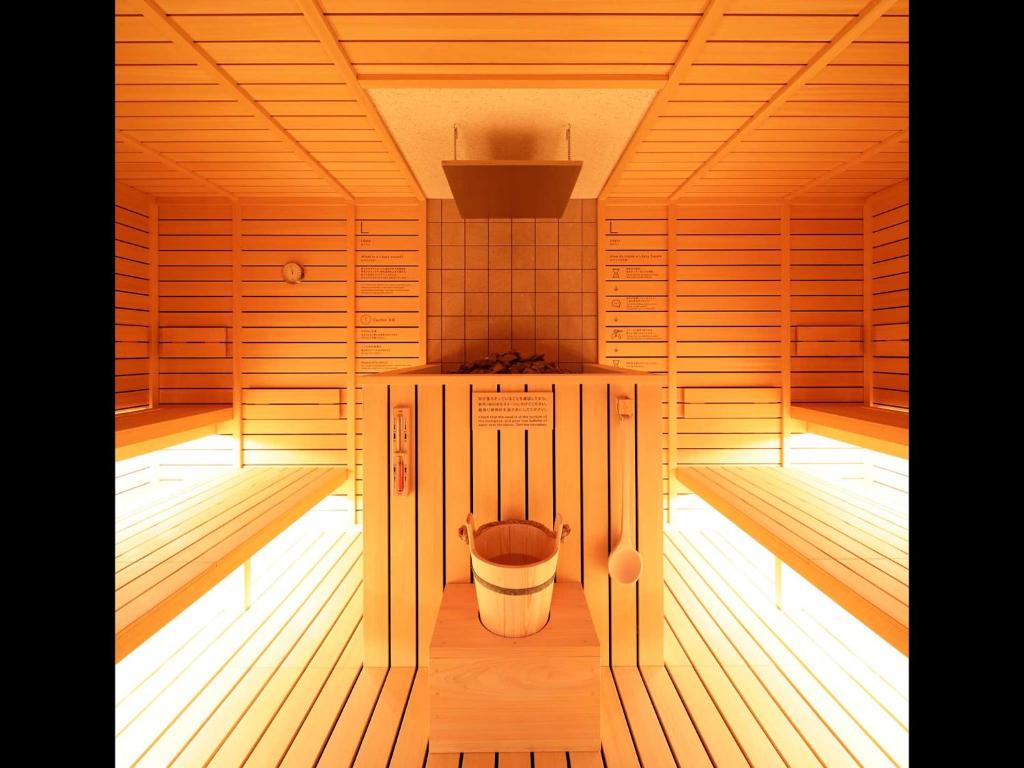 a sauna with a toilet in the middle of it at Do-c Shibuya Ebisu in Tokyo