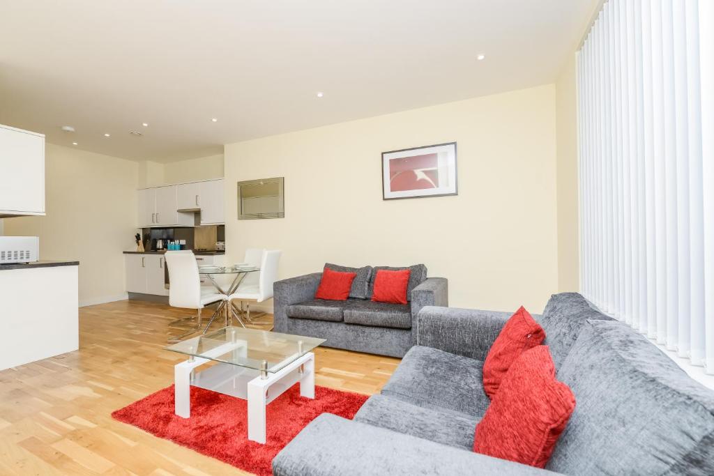 a living room with a couch and a table at PSF Panorama Apartments in Ashford