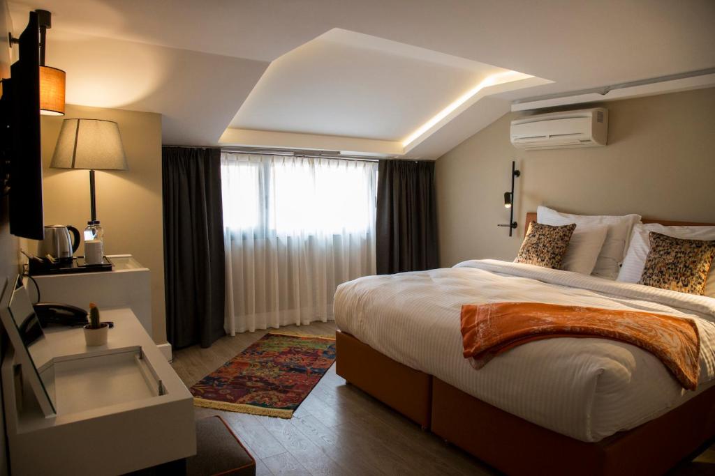 Postel nebo postele na pokoji v ubytování Sparkle Hotel