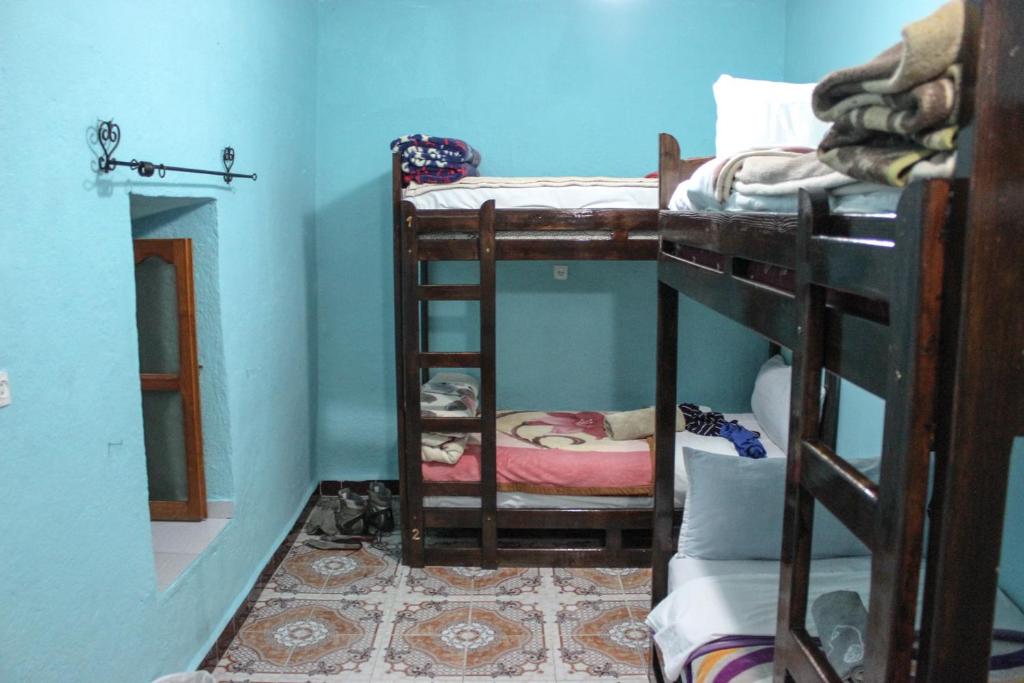 Letto o letti a castello in una camera di Hotel Souika