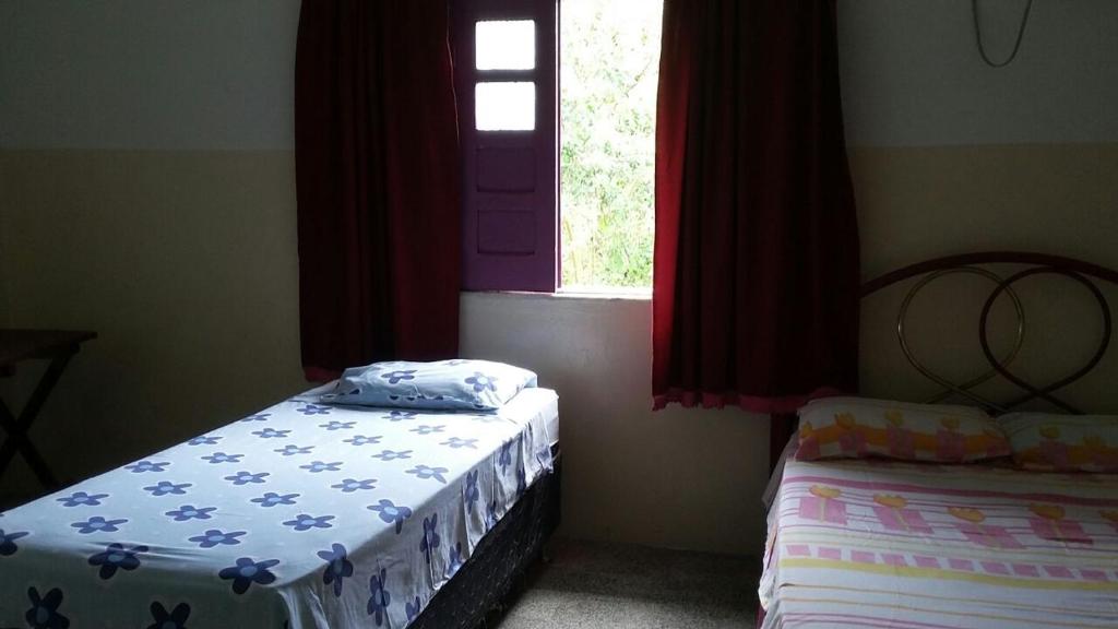 Postel nebo postele na pokoji v ubytování Residencial Ravasco