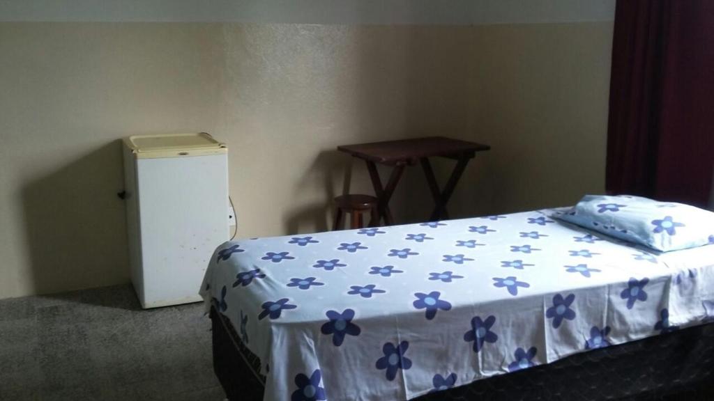 Postel nebo postele na pokoji v ubytování Residencial Ravasco