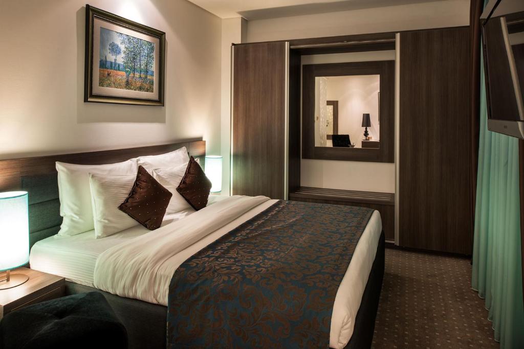 Postel nebo postele na pokoji v ubytování Hotel Nartel