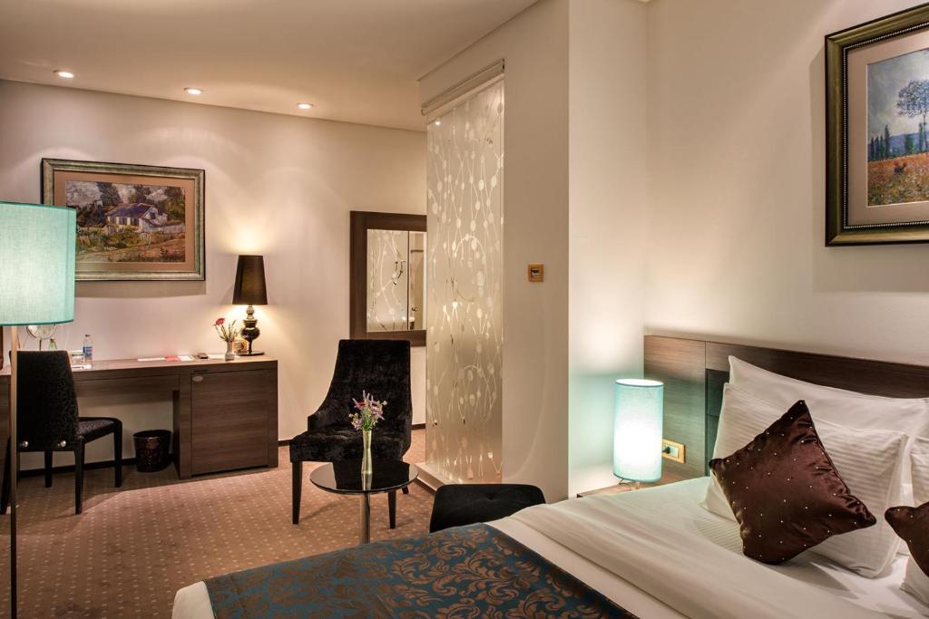 Postel nebo postele na pokoji v ubytování Hotel Nartel