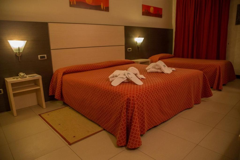 Postel nebo postele na pokoji v ubytování Albergo della Posta