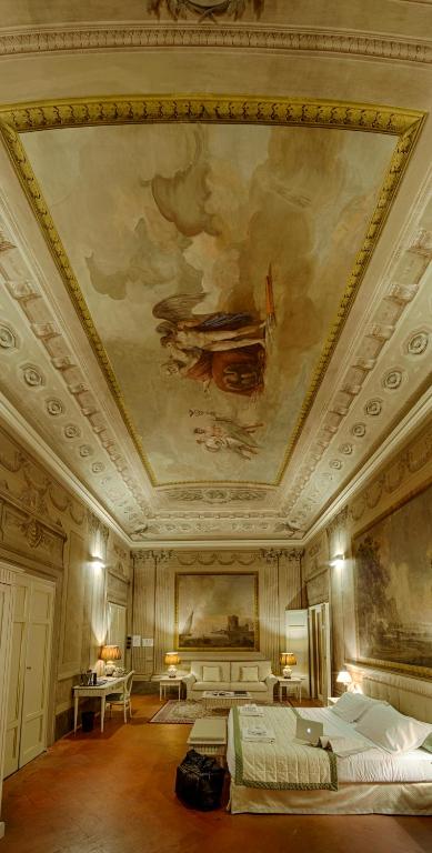 Postel nebo postele na pokoji v ubytování Palazzo Guicciardini