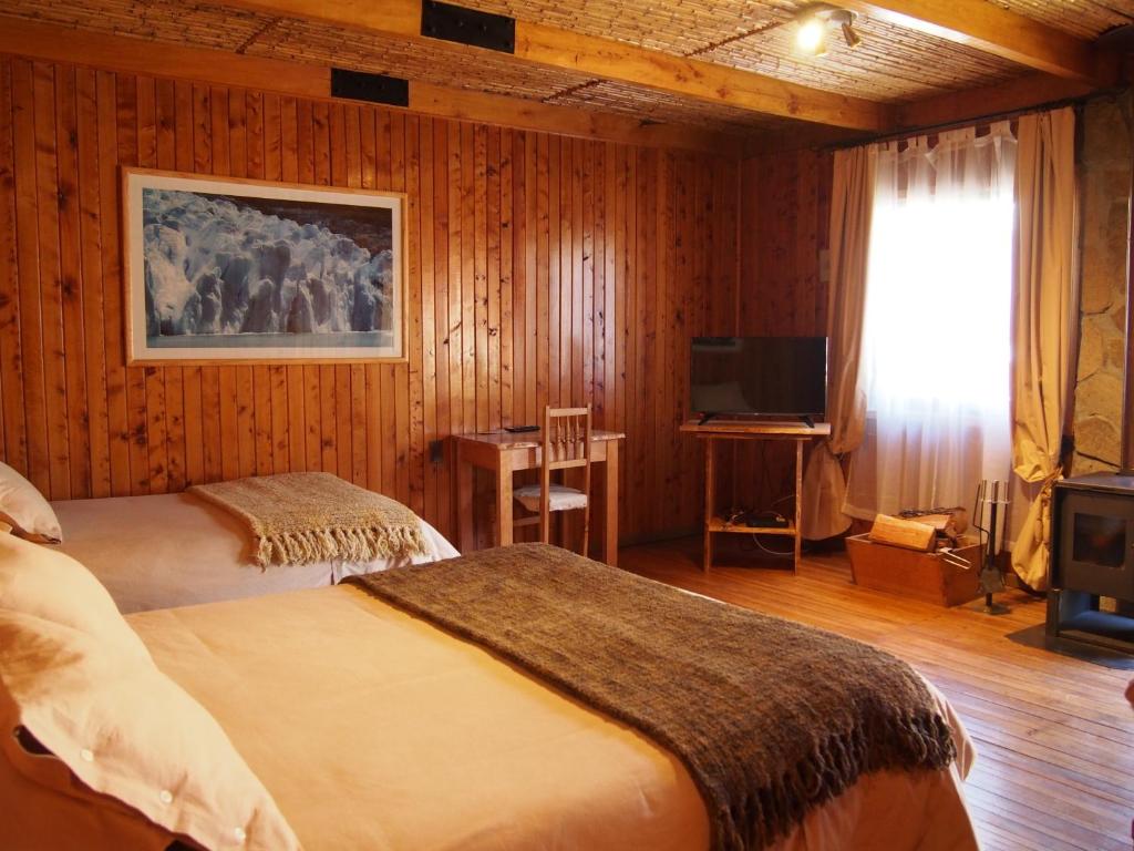 Ein Bett oder Betten in einem Zimmer der Unterkunft Hotel Último Paraíso