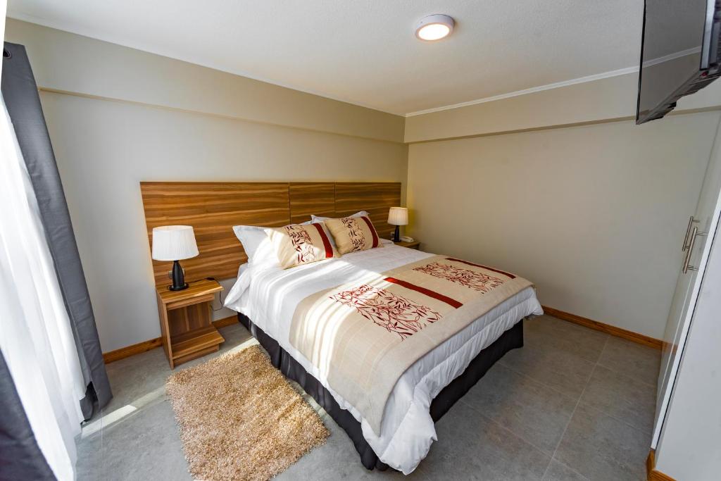 Una cama o camas en una habitación de Hotel Insigne
