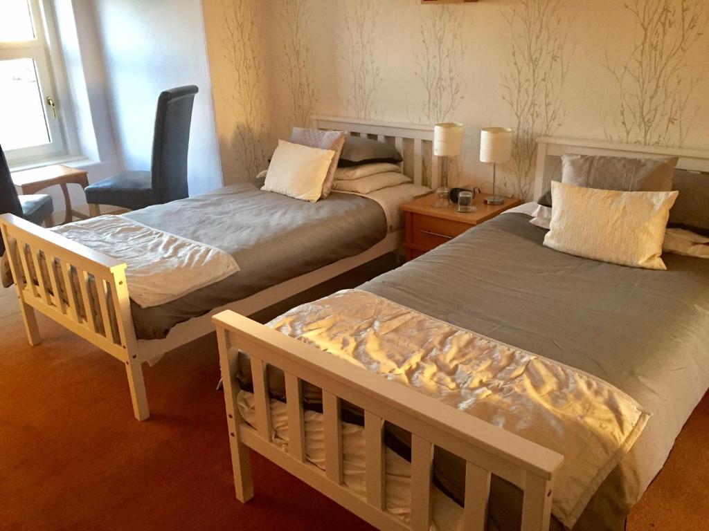Postel nebo postele na pokoji v ubytování The Arrandale Hotel