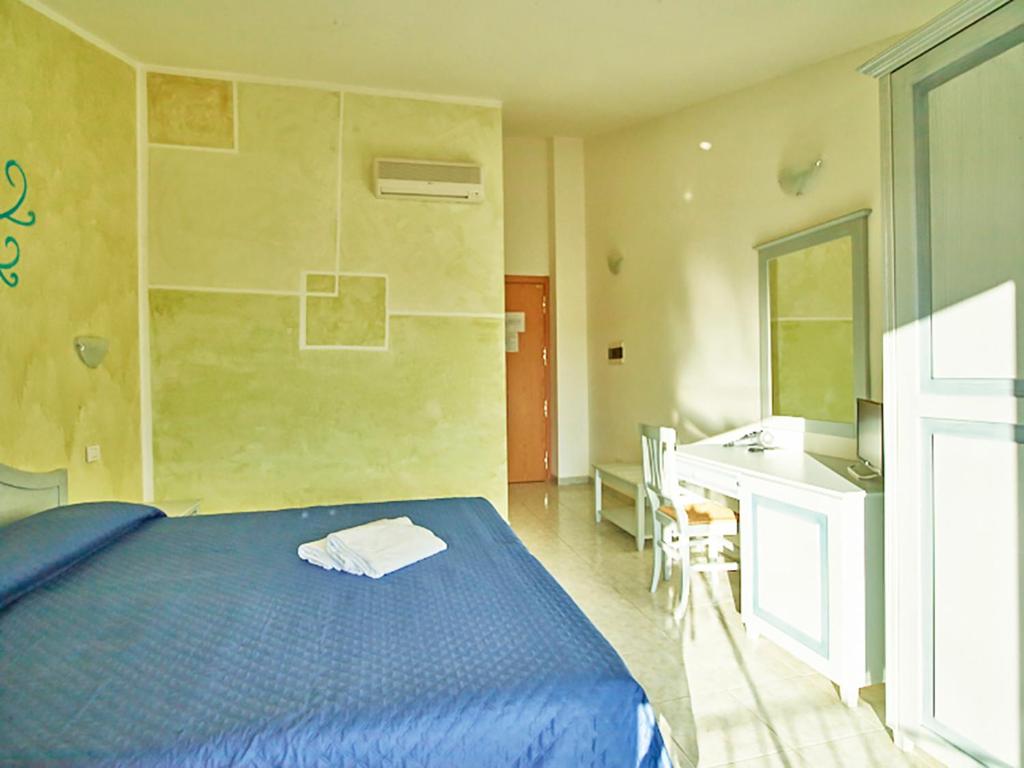 Postel nebo postele na pokoji v ubytování Hotel Jasmine