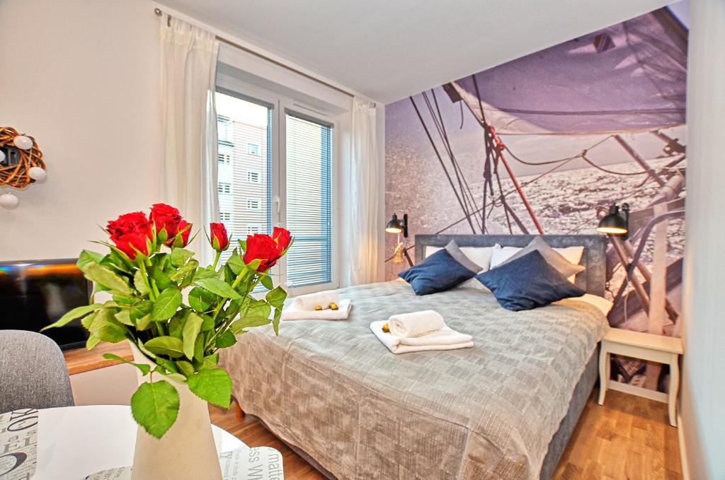 Posteľ alebo postele v izbe v ubytovaní Tartaczna Deluxe Apartments Gdansk