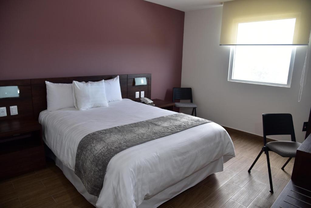 Postel nebo postele na pokoji v ubytování Lithio Hotel