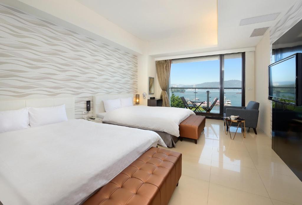 Un ou plusieurs lits dans un hébergement de l'établissement Hu Yue Lakeview Hotel