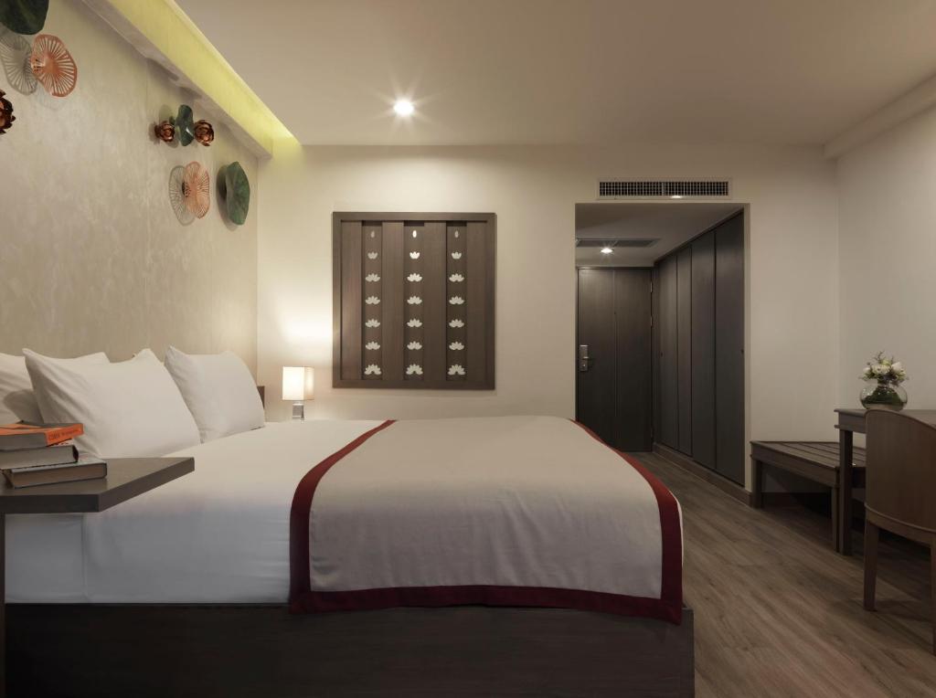 Postel nebo postele na pokoji v ubytování Chanalai Flora Resort, Kata Beach