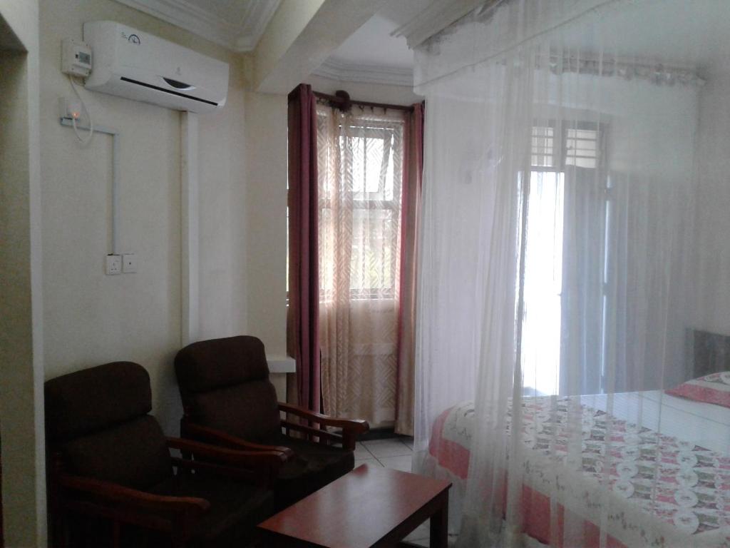 Postel nebo postele na pokoji v ubytování Coastgate Hotel