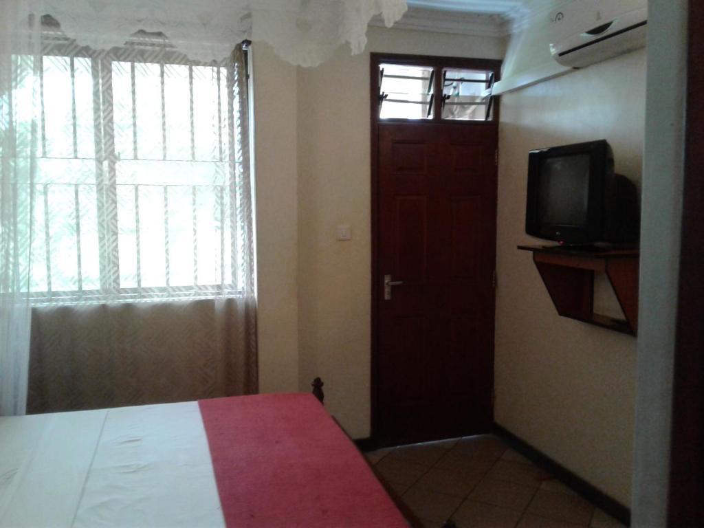 Postel nebo postele na pokoji v ubytování Coastgate Hotel