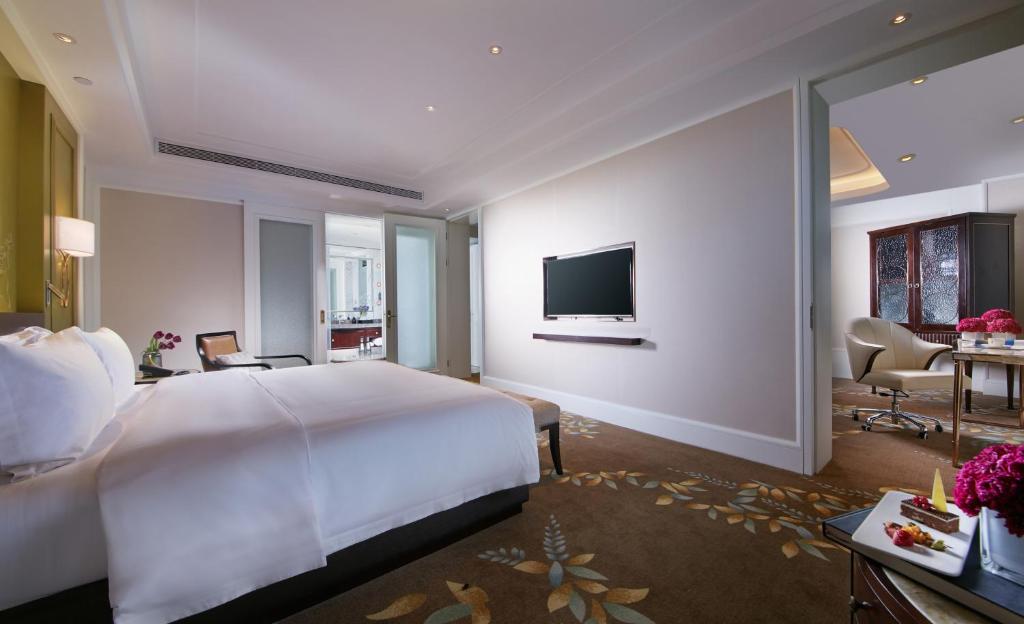 Postel nebo postele na pokoji v ubytování Wen Ling International Hotel