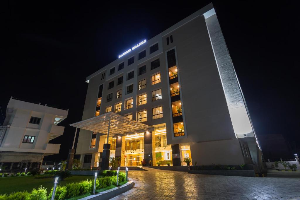 a building with a light on top of it at night at Classic Grande,a Member of Radisson in Imphal