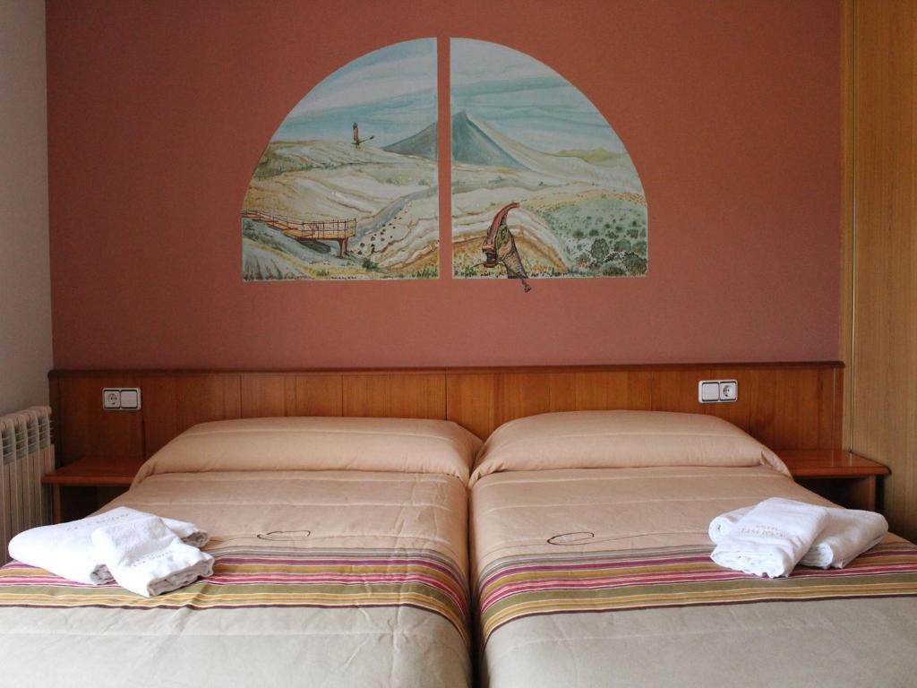 Postel nebo postele na pokoji v ubytování Hotel Casa Domenc