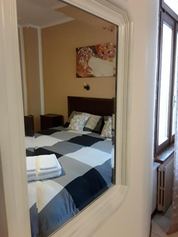 Postel nebo postele na pokoji v ubytování Camere Porto Vecchio con parcheggio a pochi passi dal castello
