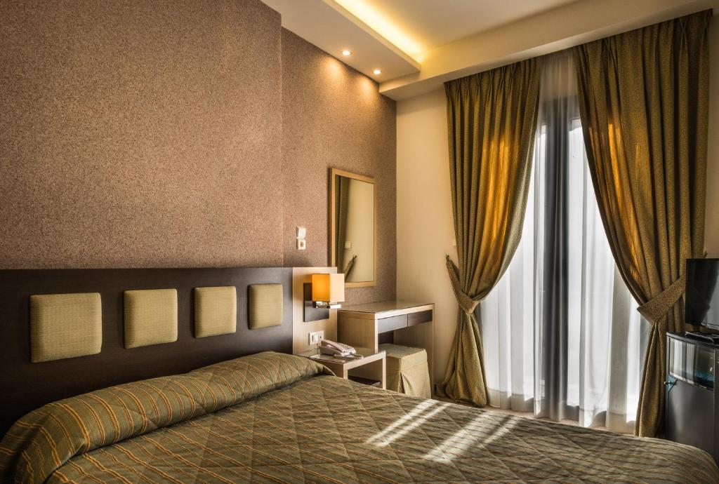 Postel nebo postele na pokoji v ubytování Rex Hotel