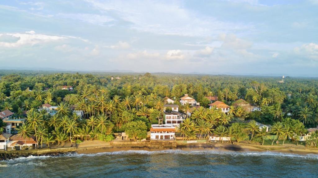 an aerial view of a house on a tropical island at Guesthouse Panorama in Beruwala