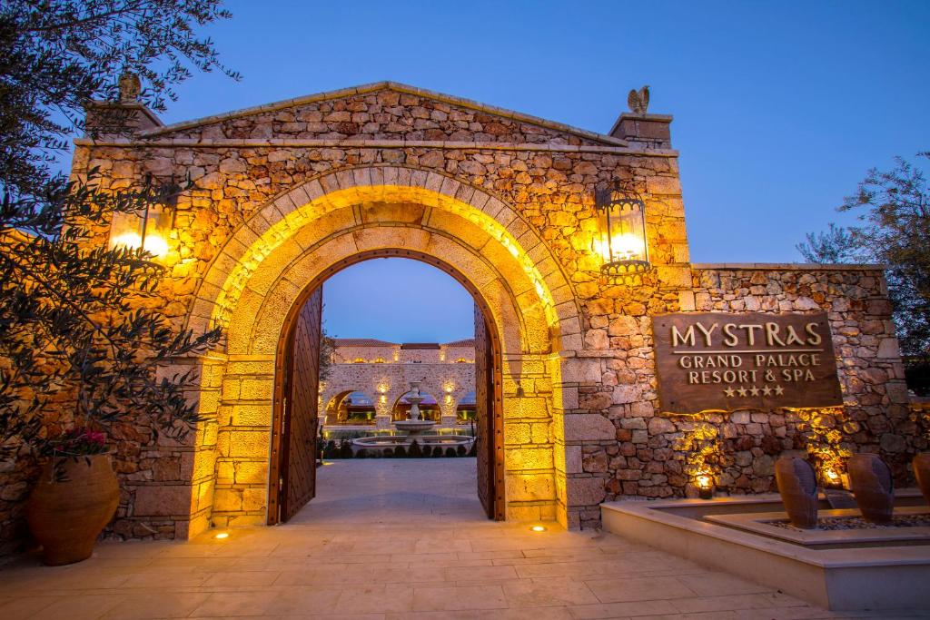 an entrance to a stone building with an arch at Mystras Grand Palace Resort & Spa in Mystras